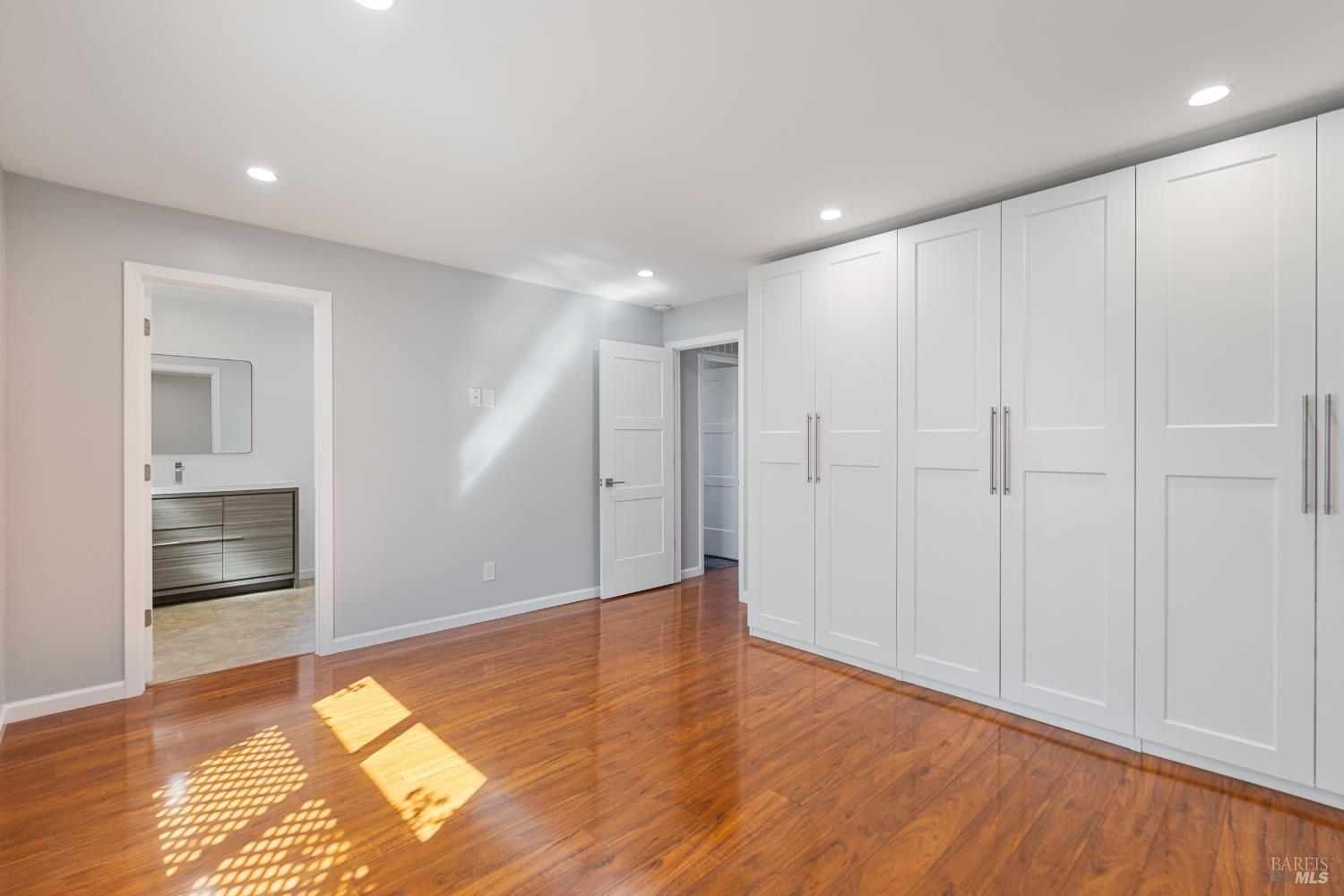 363 Glacier Way San Rafael, CA 94903 - Photo 18 of 32 Primary bedroom with closets looking into primary bathroom