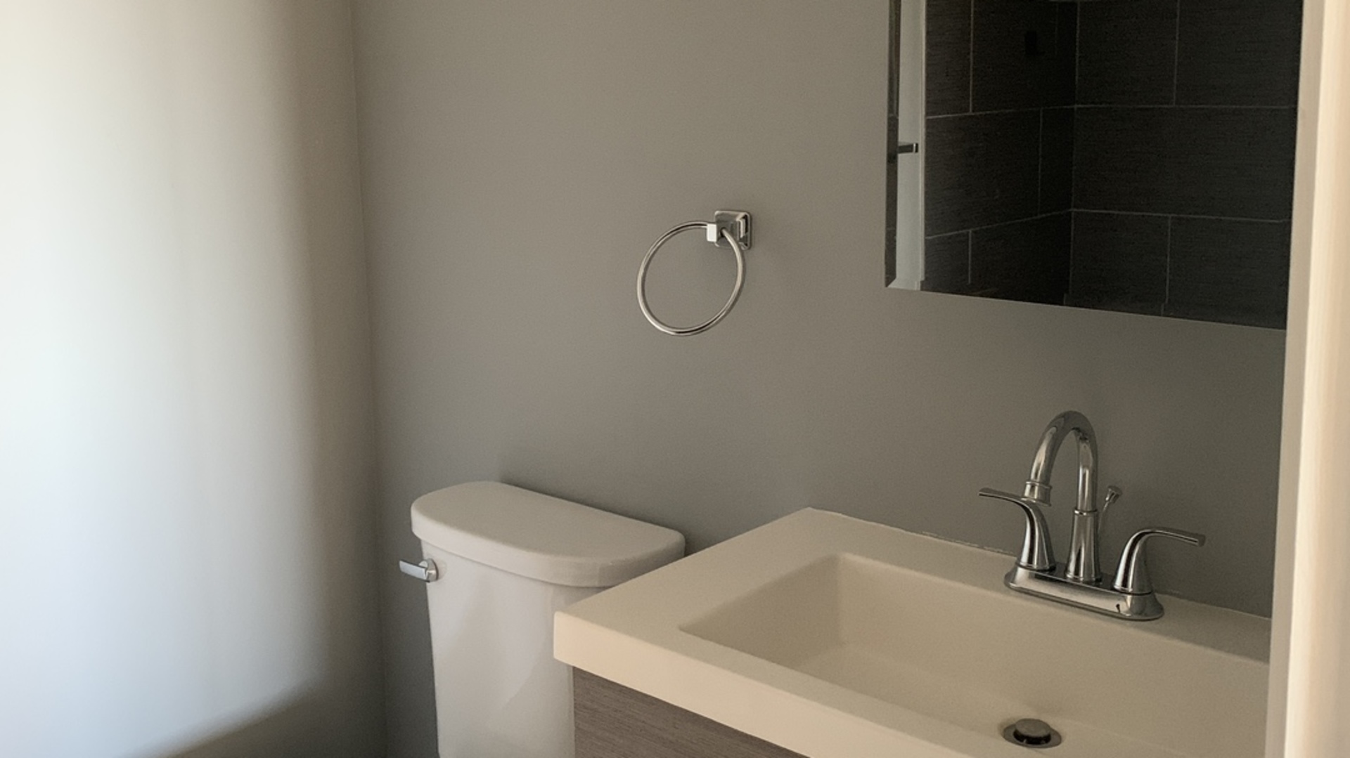 8141 84th Place, Unit 2D Justice, IL 60458 - Photo 16 of 19 a bathroom with a sink and a vanity