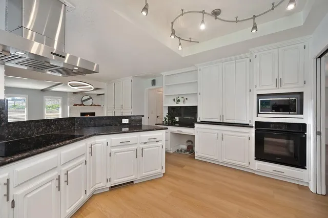 a kitchen with a refrigerator and window