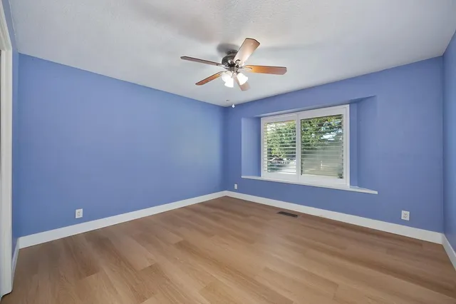 a bathroom with double vanity sink a mirror and a shower
