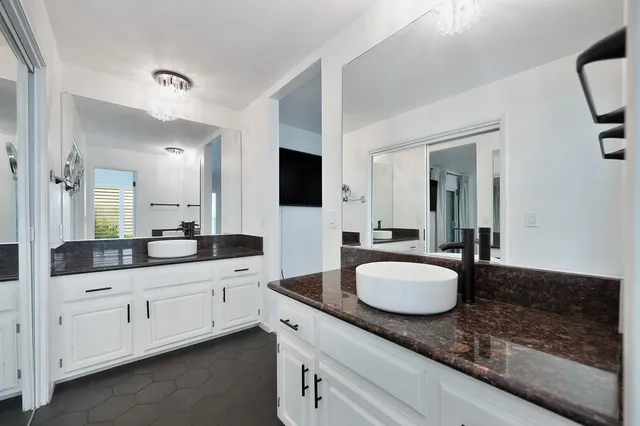 a bathroom with a toilet sink and shower