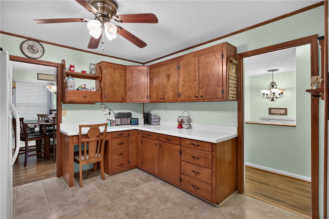 104 Laurel Lane Seneca, SC 29678 - Photo 11 of 36 A well-appointed kitchen features ample wood cabinetry and durable countertops, ready for daily living.