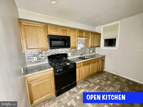a kitchen with a stove and a microwave