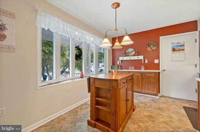 a kitchen with stainless steel appliances granite countertop a stove and a refrigerator