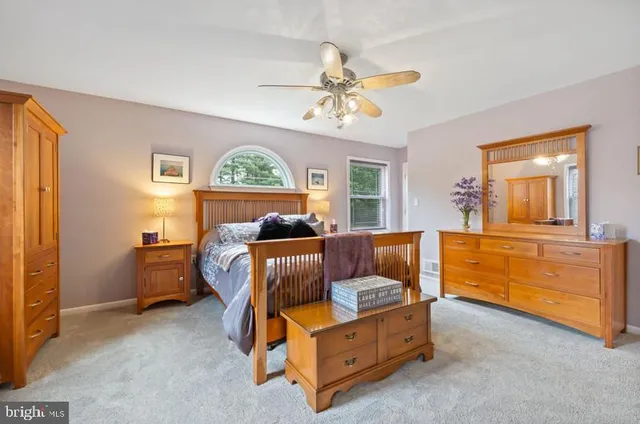 a bed room with furniture and a window