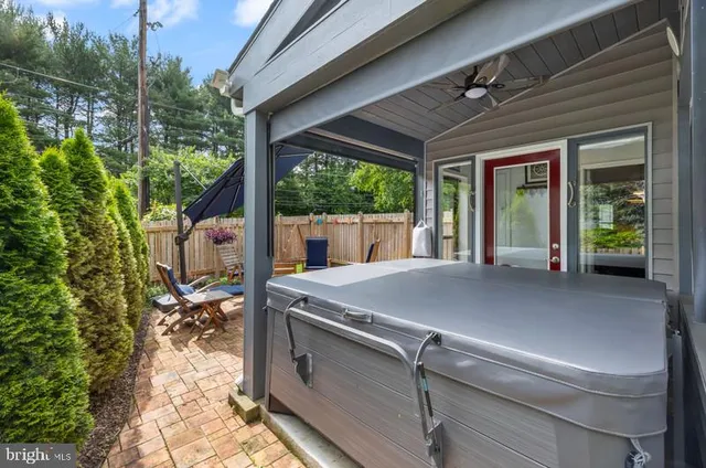 a view of a house with a porch and furniture