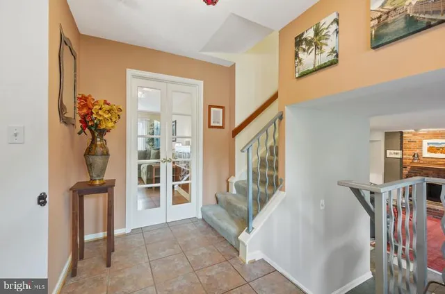 a view of an entryway with wooden floor and windows