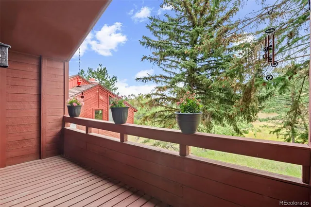 a balcony with wooden floor and deck