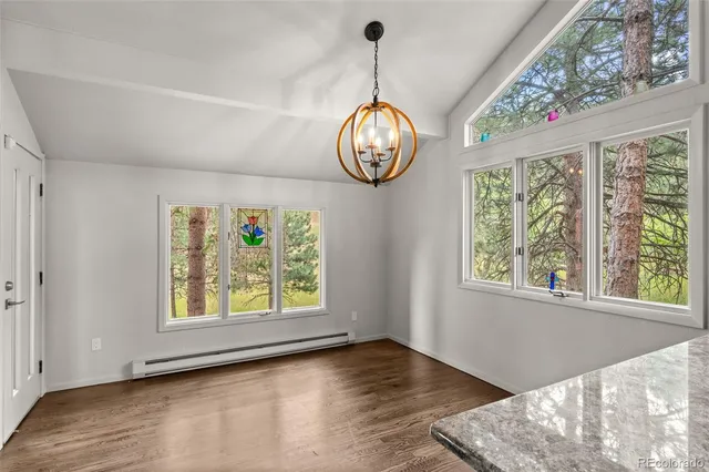a view of an entryway with wooden floor