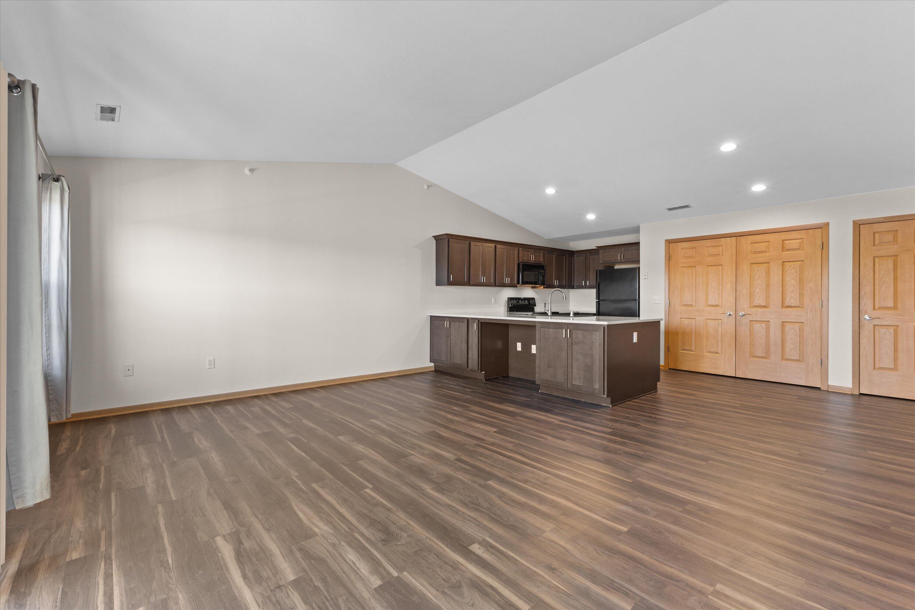 6746 100th Place, Unit E Pleasant Prairie, WI 53158 - Photo 4 of 21 Living/Dining Area Facing Kitchen