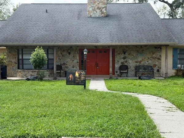a view of a house with garden and plants