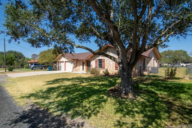 a view of outdoor space with swimming pool and trees