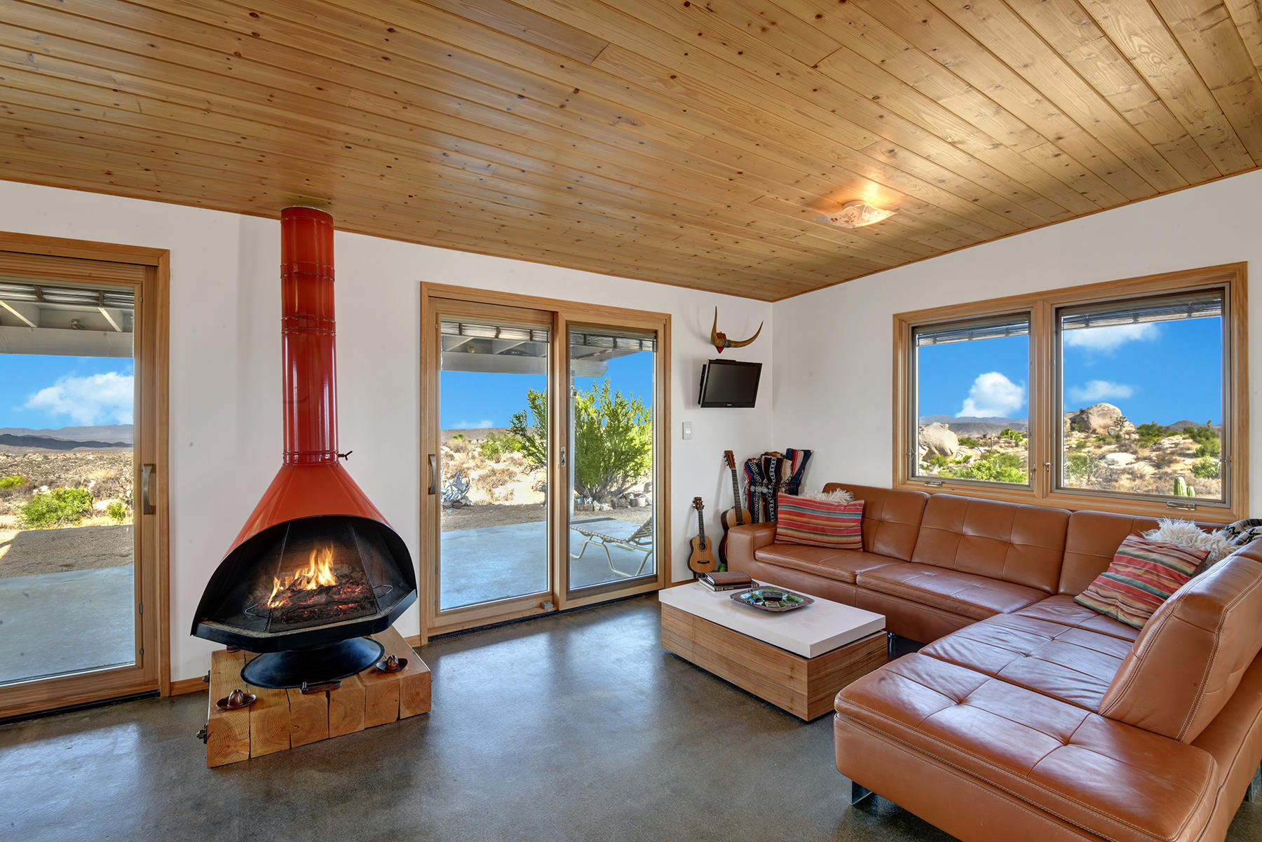 CABIN LIVING ROOM WITH FIREPLACE TO VIEW