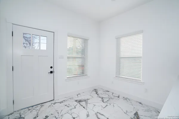 a view of a bedroom with window