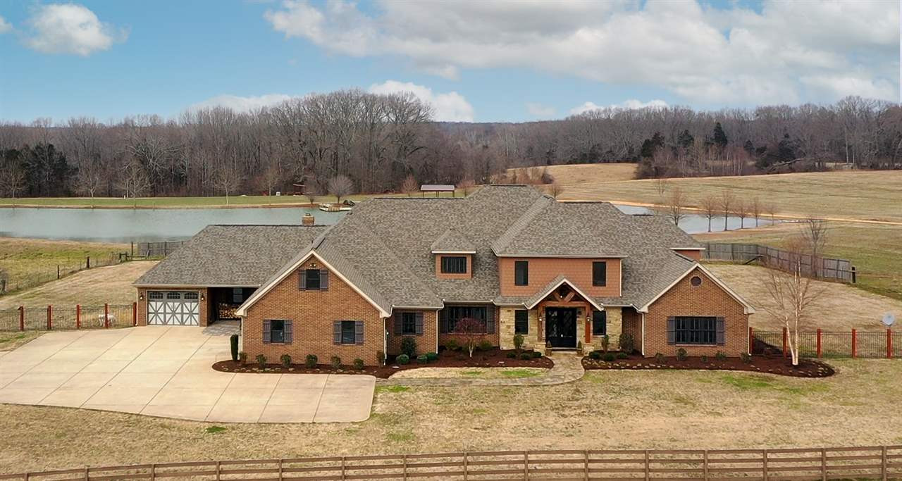 899 Cotton Grove Road Jackson, TN 38305 - Photo 1 of 1 an aerial view of a house with a yard