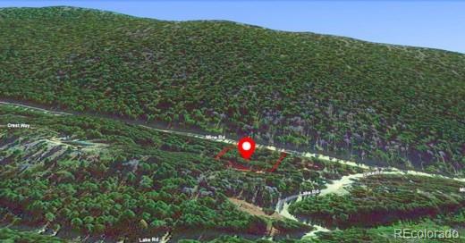 Mine Road Idaho Springs, CO 80452 - Photo 5 of 7 a view of a houses with a lush green forest