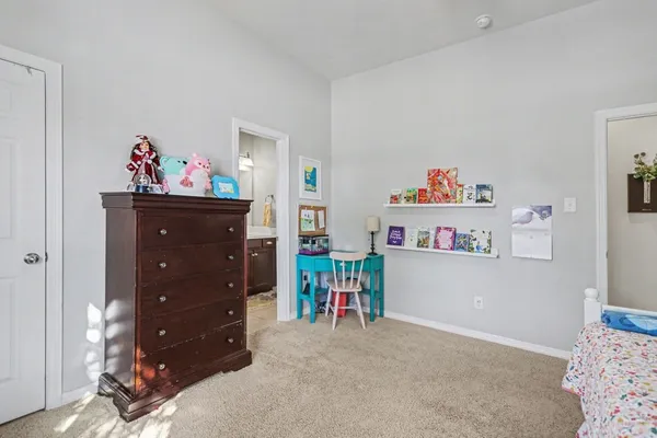 a bed room with a bed and a baby