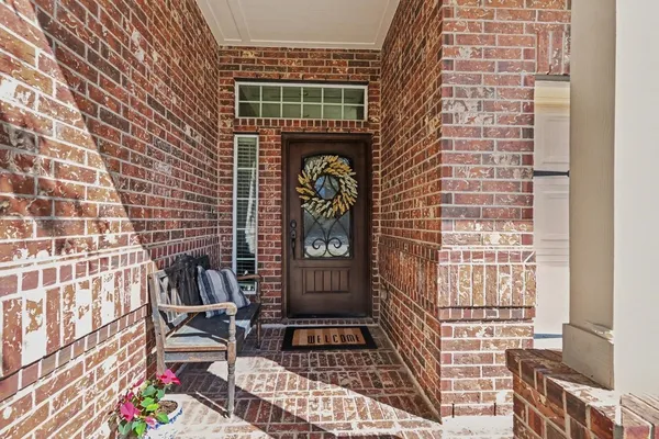 a front view of a house with outdoor seating