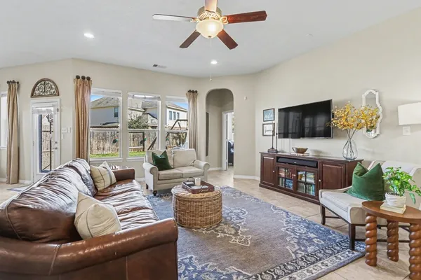 a living room with furniture and a flat screen tv