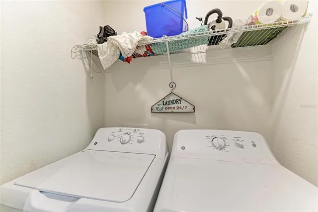 a balcony with table and chairs