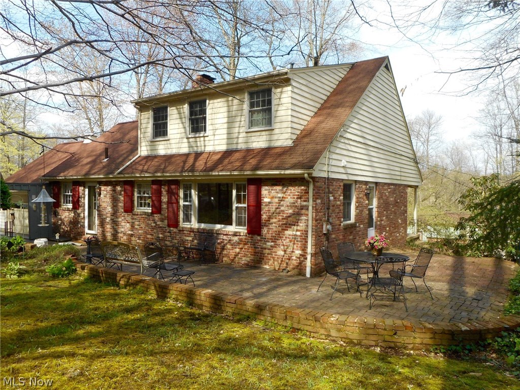 856 Old Spring Road Akron, OH 44321 - Photo 22 of 30 The brick wraps to the back of the house as so does the patio