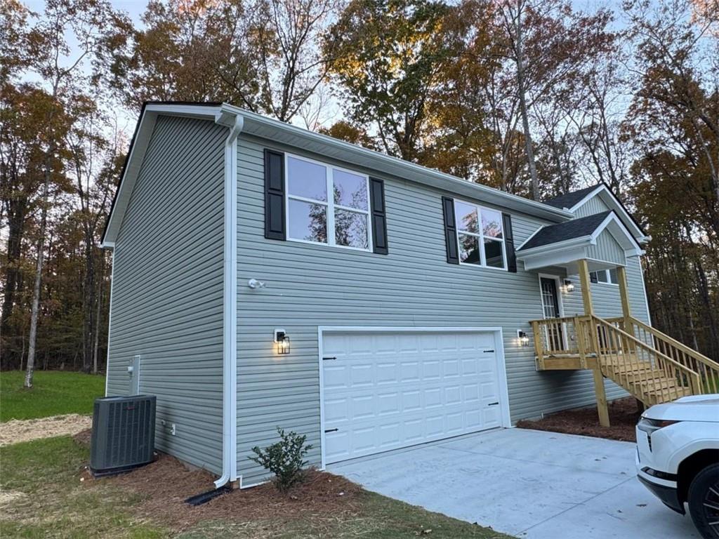 a front view of a house with parking space