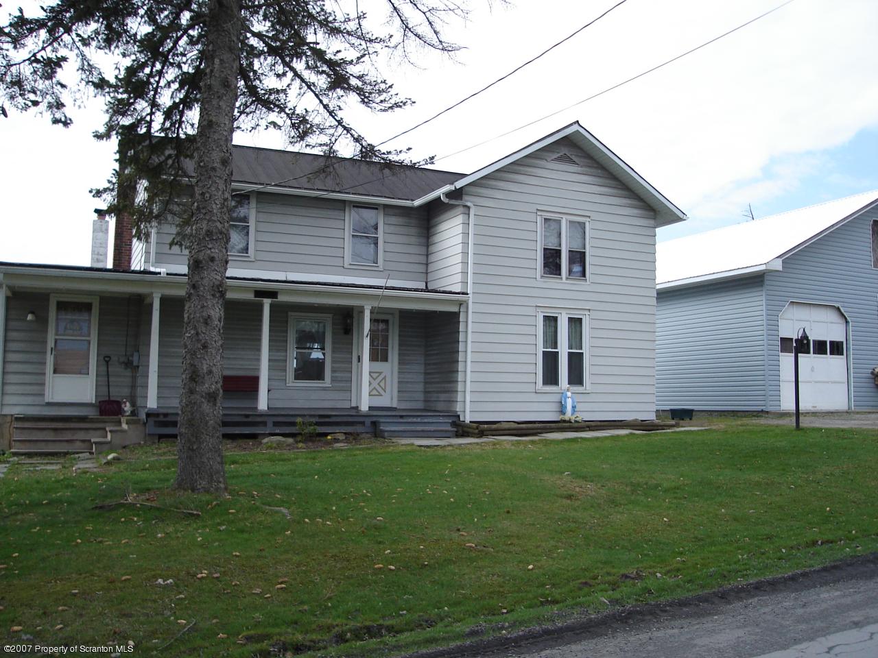 244 Sheldon Hill Road Springville, PA 18844 - Photo 1 of 7 a front view of a house with a garden