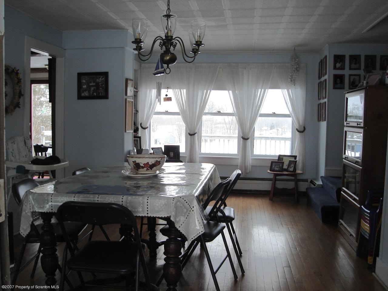 244 Sheldon Hill Road Springville, PA 18844 - Photo 4 of 7 a view of a dining room with furniture window and wooden floor