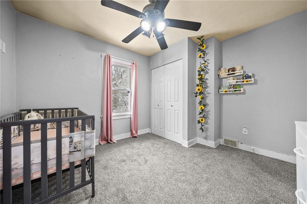 20 Haberman Avenue Pittsburgh, PA 15211 - Photo 19 of 22 a view of an empty room with a window and a ceiling fan