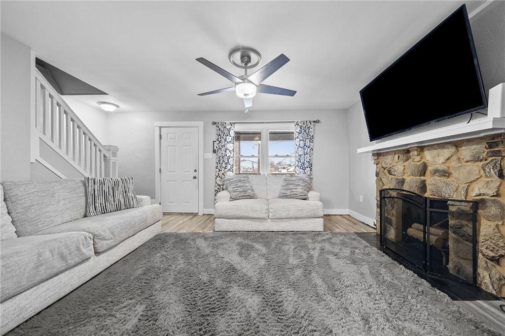 20 Haberman Avenue Pittsburgh, PA 15211 - Photo 4 of 22 a living room with fireplace furniture and a flat screen tv