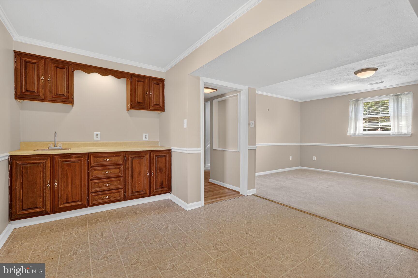 2806 Logway Road Vienna, VA 22181 - Photo 23 of 33 a view of an empty room with cabinet and a window