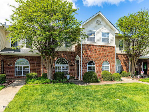 2101 Piney Brook Road, Unit 105 Raleigh, NC 27614 - Photo 1 of 24 front view of a house with a yard