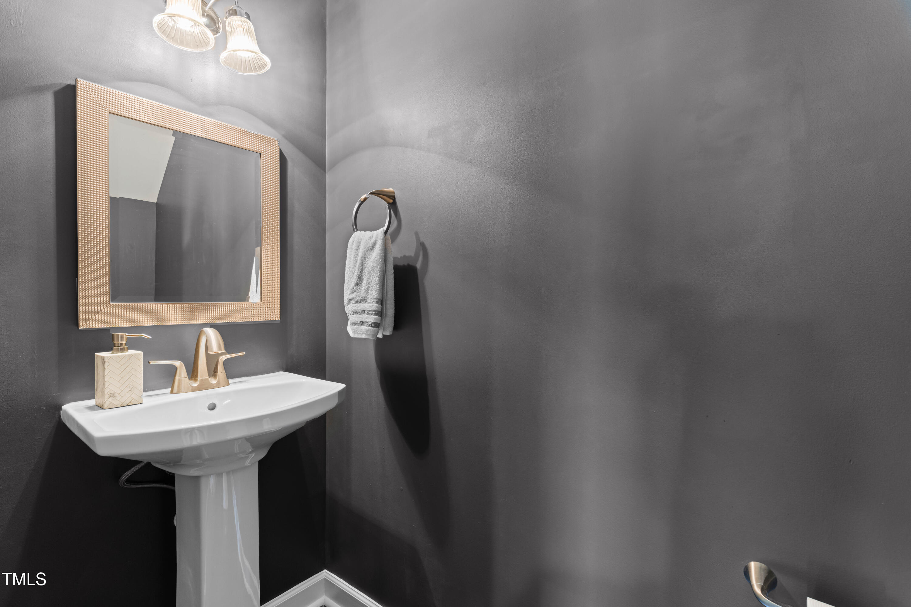 2101 Piney Brook Road, Unit 105 Raleigh, NC 27614 - Photo 10 of 24 a bathroom with a sink and a mirror