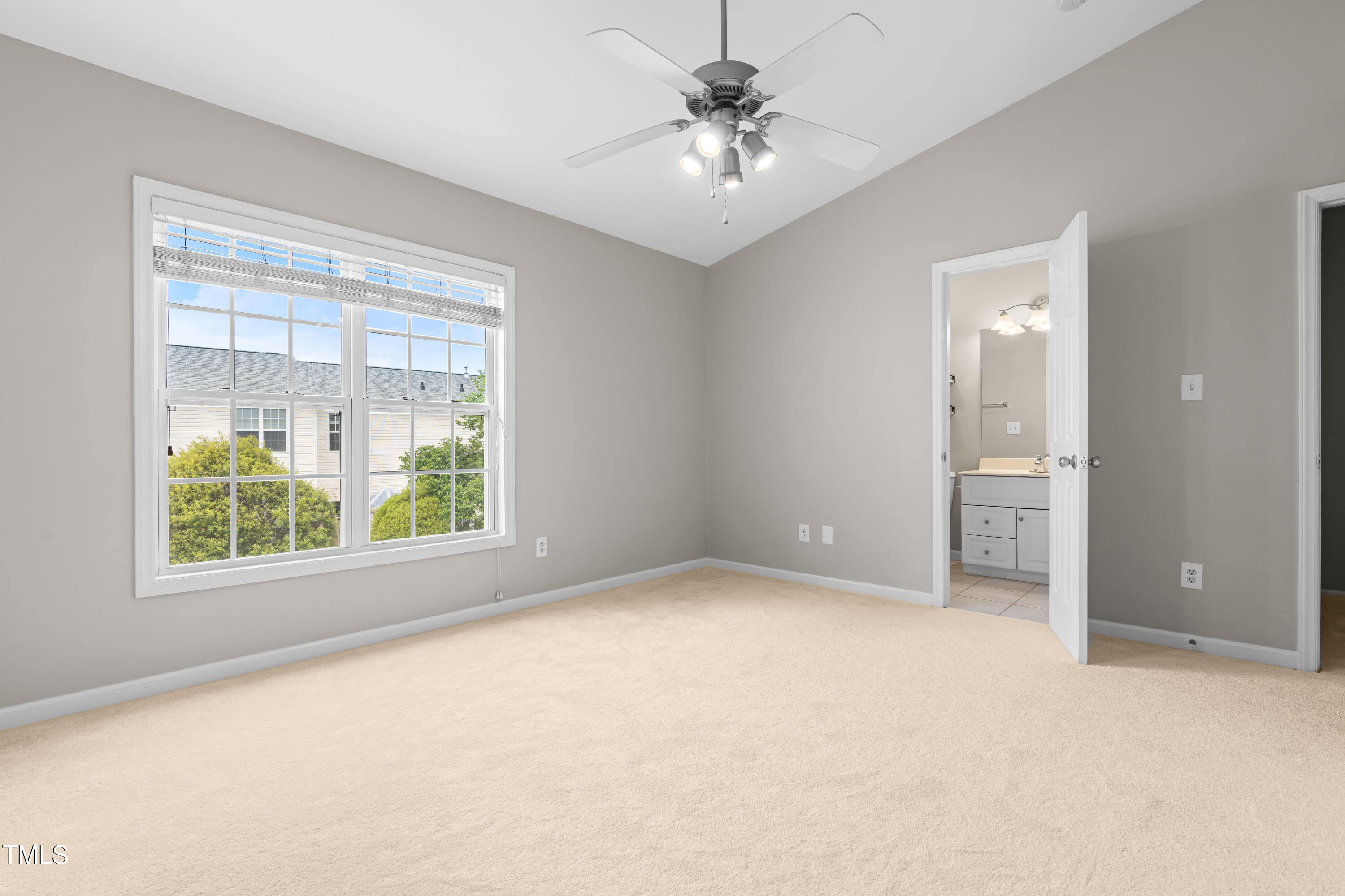 2101 Piney Brook Road, Unit 105 Raleigh, NC 27614 - Photo 11 of 24 an empty room with a bathroom and a window