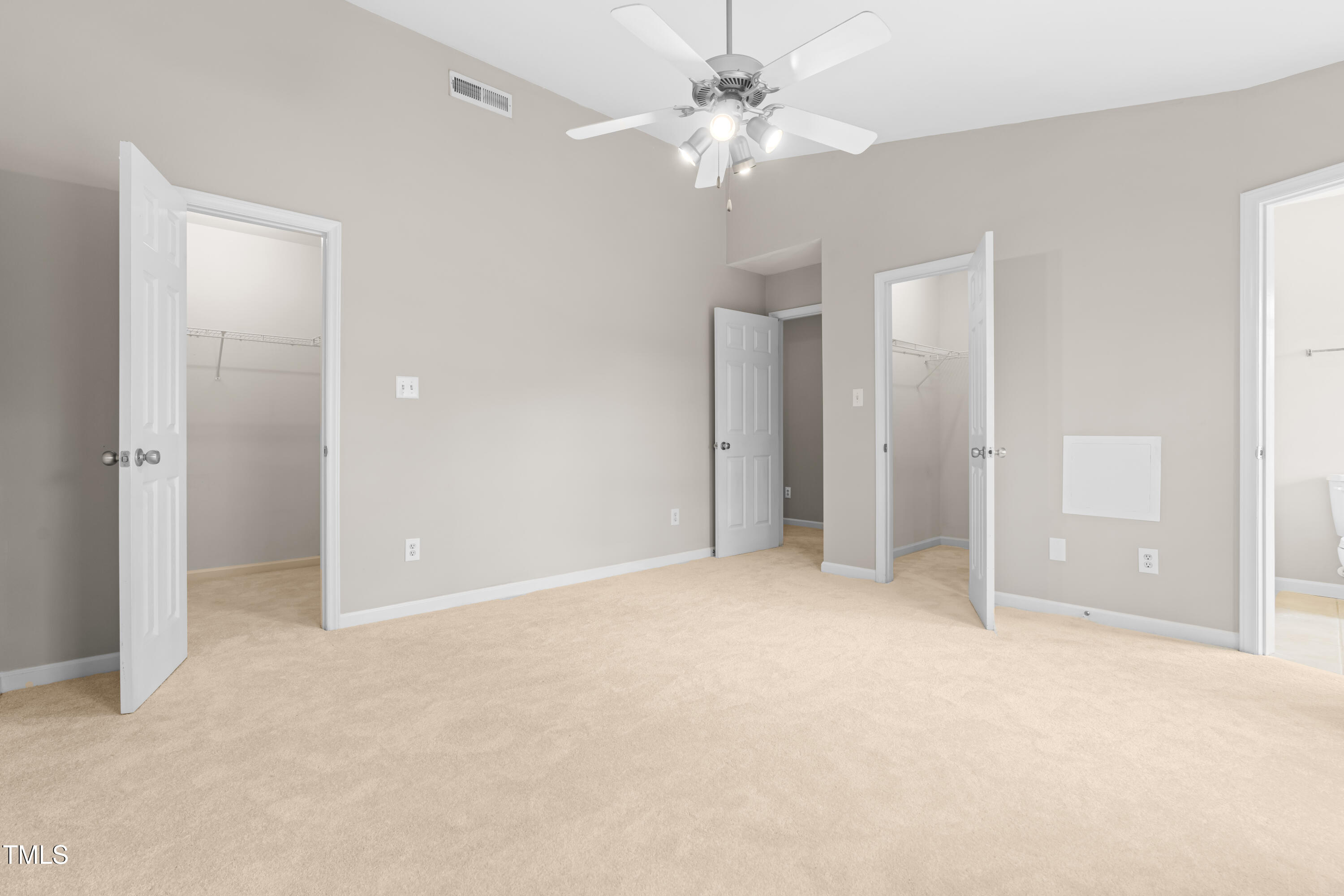 2101 Piney Brook Road, Unit 105 Raleigh, NC 27614 - Photo 15 of 24 an empty room with fan and entrance