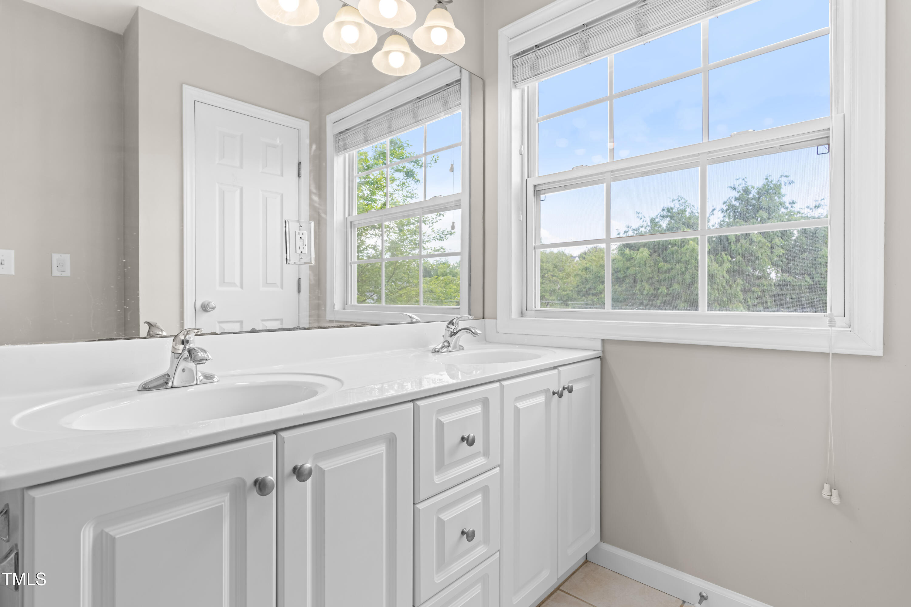2101 Piney Brook Road, Unit 105 Raleigh, NC 27614 - Photo 17 of 24 a bathroom with a granite countertop sink and a window