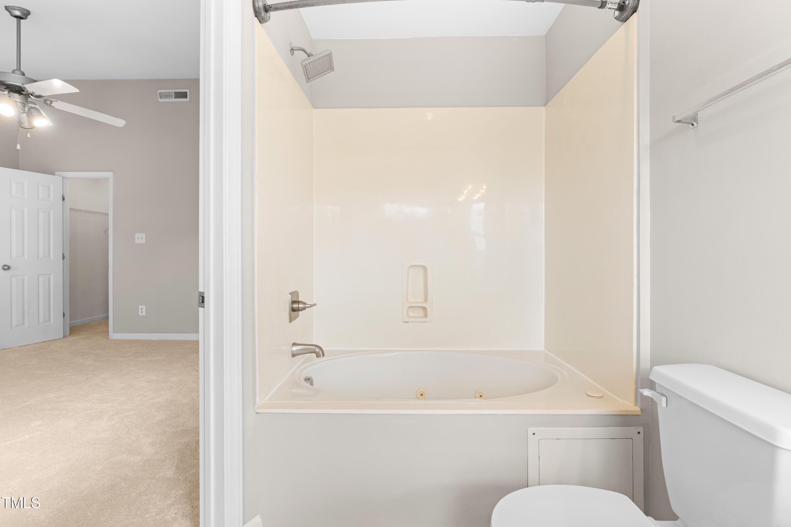 2101 Piney Brook Road, Unit 105 Raleigh, NC 27614 - Photo 18 of 24 a bathroom with a toilet and a bathtub