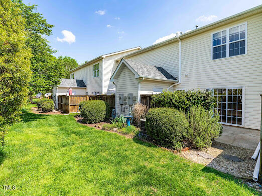 2101 Piney Brook Road, Unit 105 Raleigh, NC 27614 - Photo 20 of 24 a view of a house with a back yard