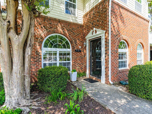 2101 Piney Brook Road, Unit 105 Raleigh, NC 27614 - Photo 2 of 24 a front view of a house with large windows
