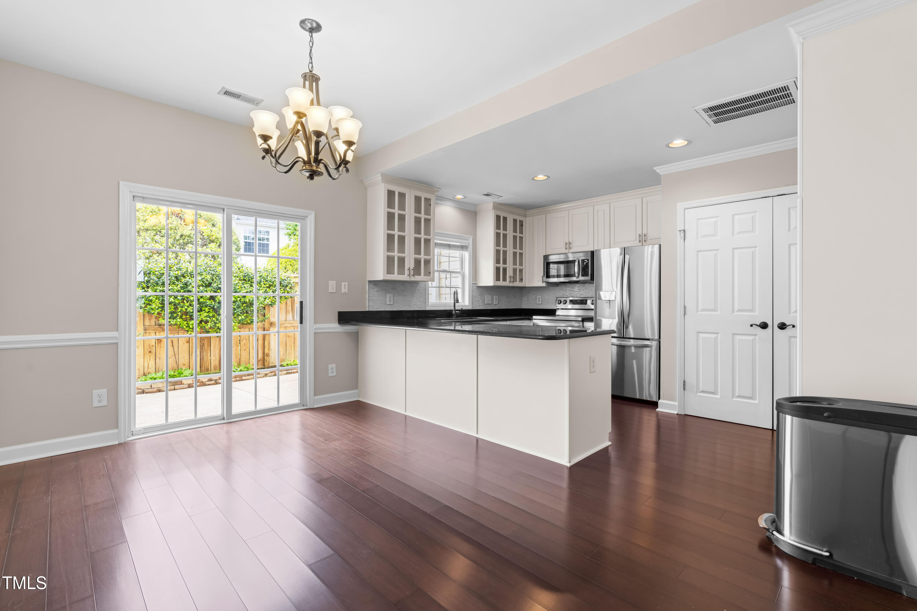 2101 Piney Brook Road, Unit 105 Raleigh, NC 27614 - Photo 6 of 24 a view of kitchen with granite countertop stainless steel appliances cabinets and wooden floor