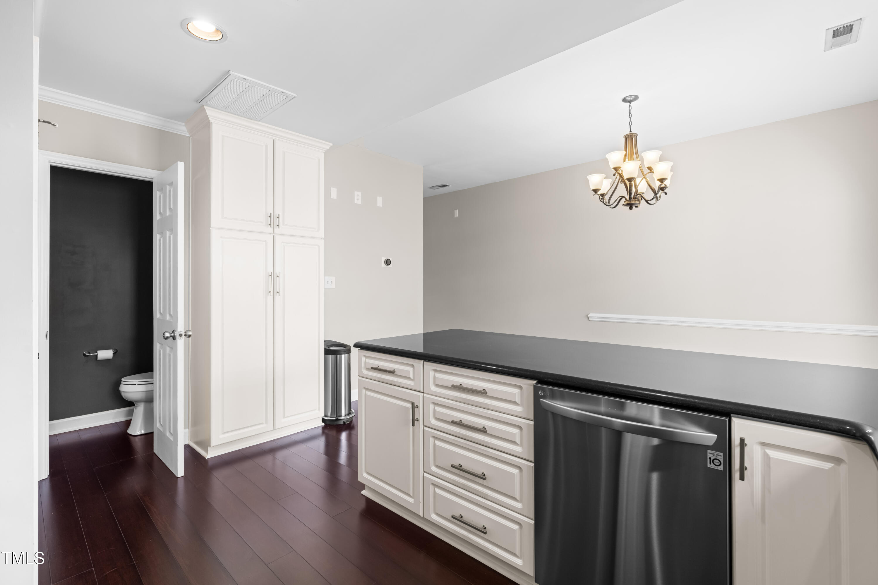 2101 Piney Brook Road, Unit 105 Raleigh, NC 27614 - Photo 9 of 24 a kitchen with granite countertop a cabinets and wooden floor