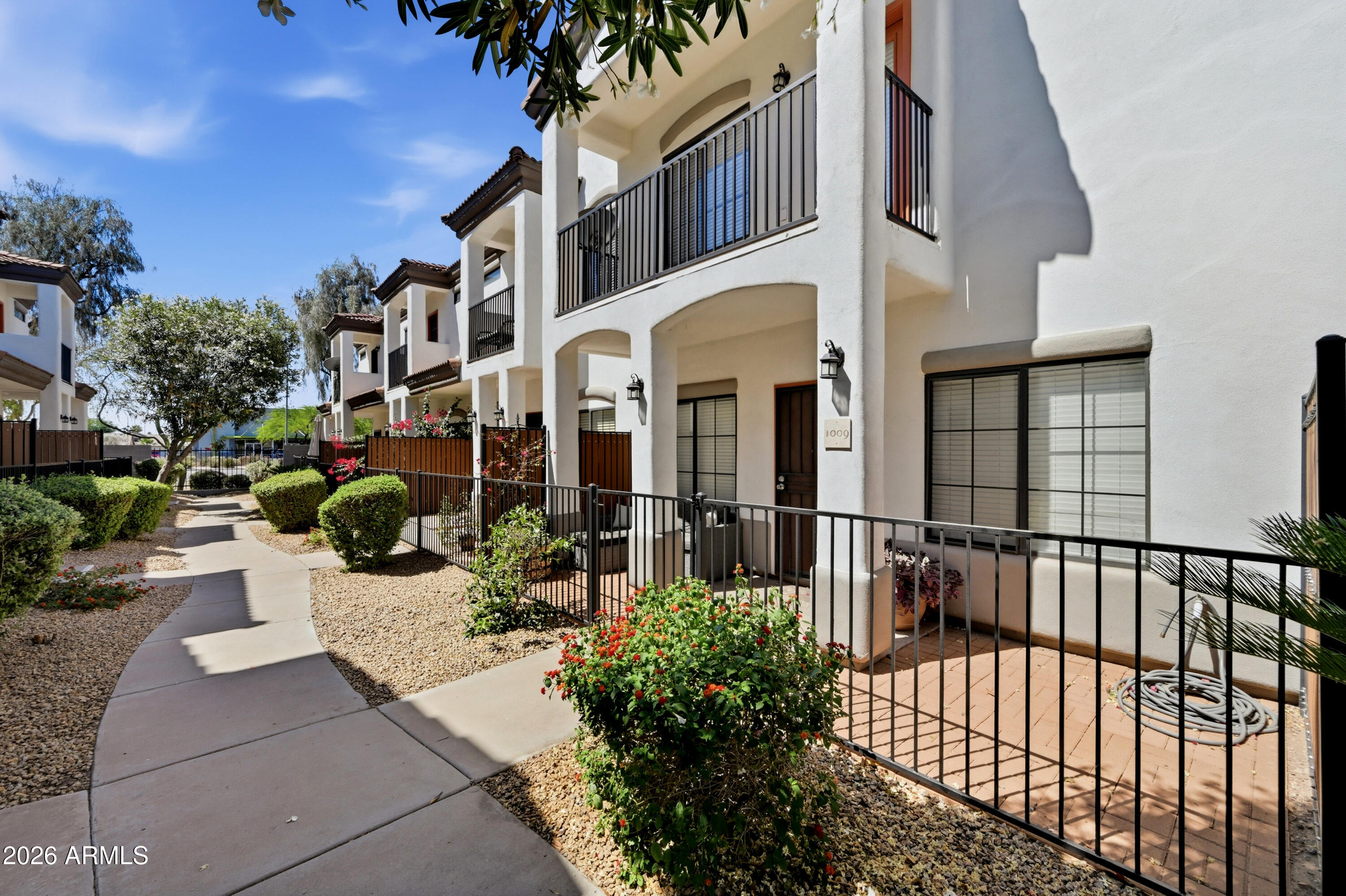 3150 East Beardsley Road, Unit 1009 Phoenix, AZ 85050 - Photo 2 of 31 a view of a building with sitting area