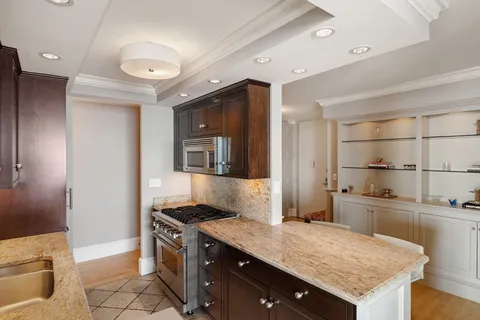 a kitchen with a stove a sink and a refrigerator