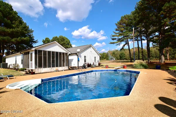 a view of a swimming pool with an outdoor space