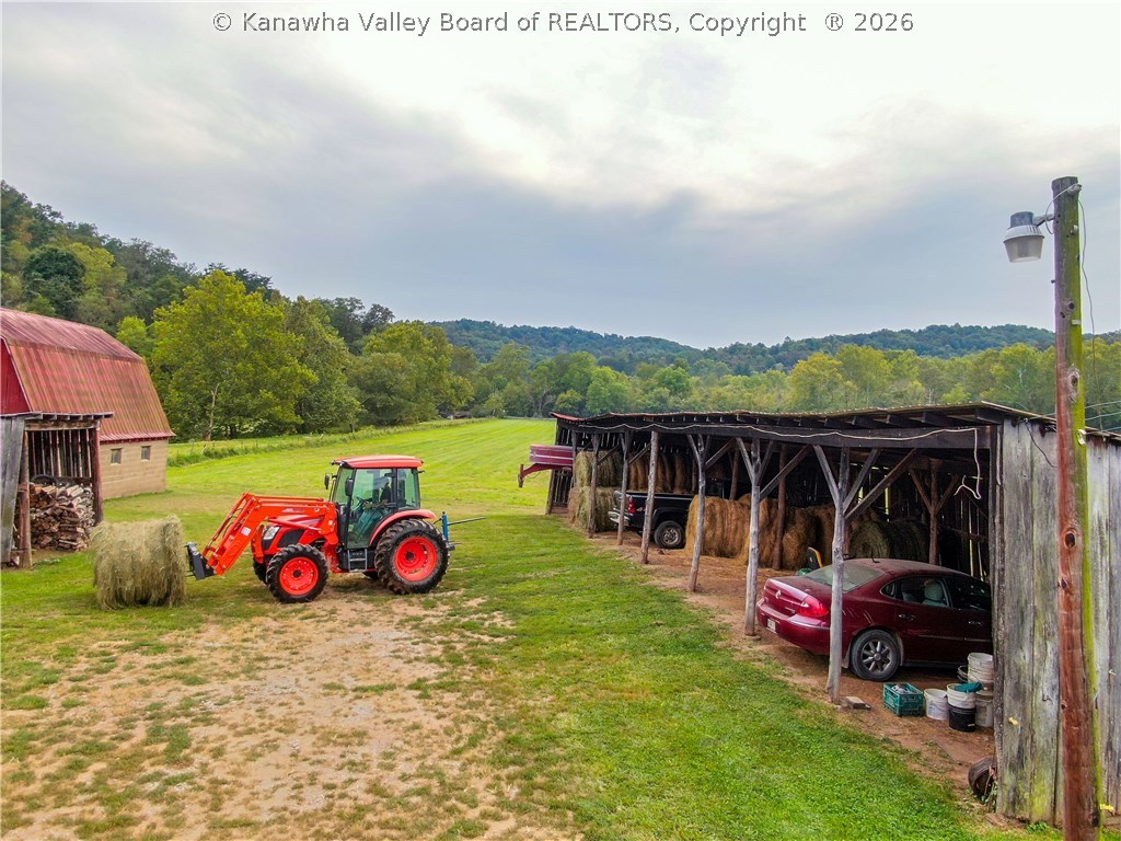 194 Plum Orchard Road Ripley, WV 25271 - Photo 31 of 42 Lots of room to park various equipment, vehicles, and stack round bales of hay.