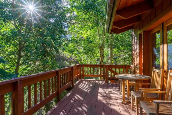 a view of a balcony with furniture