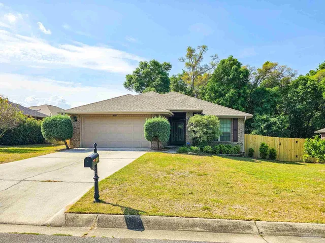 a view of a swimming pool with a yard