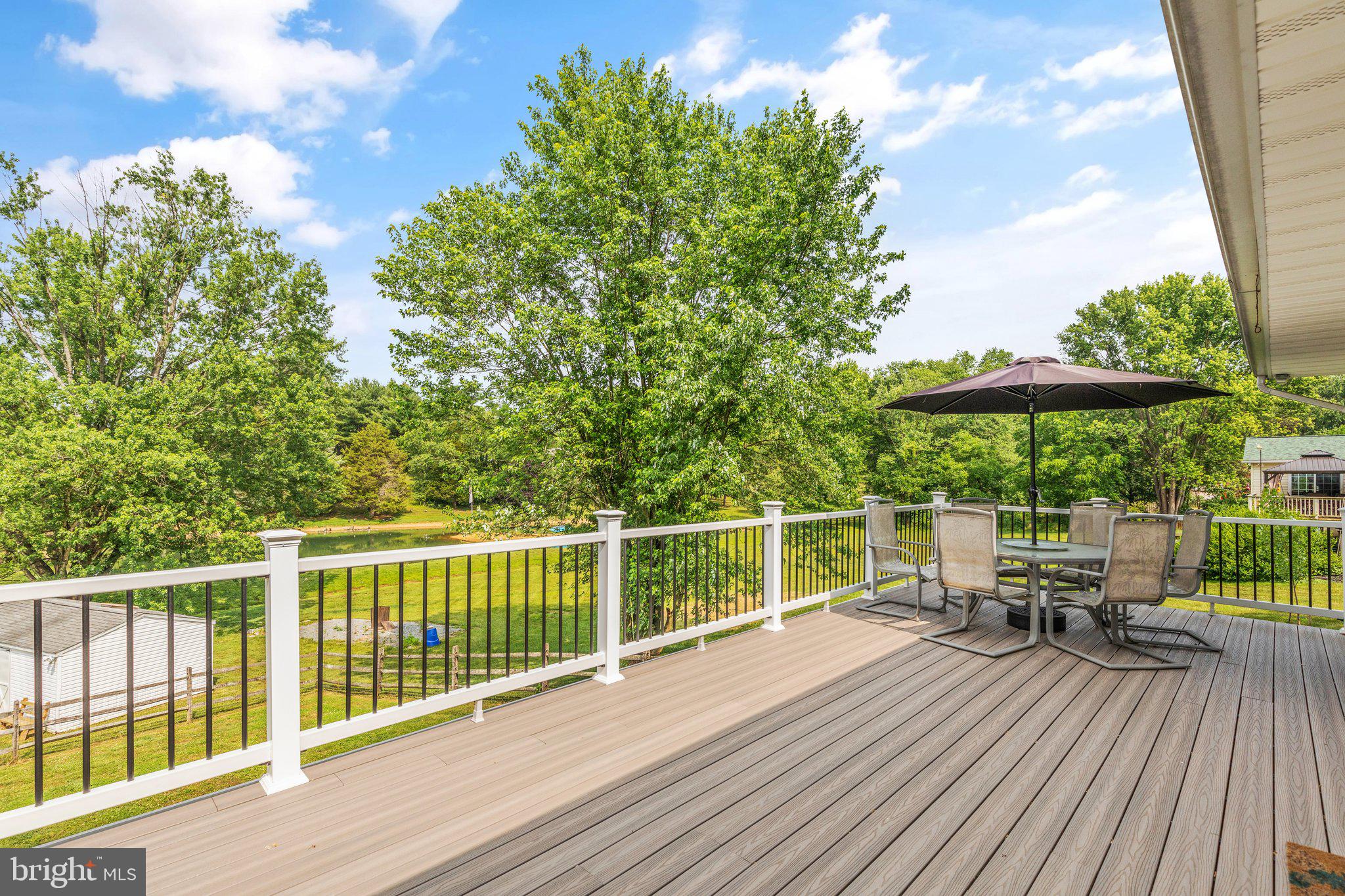 6826 Woodbine Road Delta, PA 17314 - Photo 24 of 32 Large, Maintenance Free Deck Off Kitchen & Primary