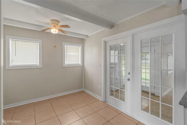 a view of a backyard with a garden and trees
