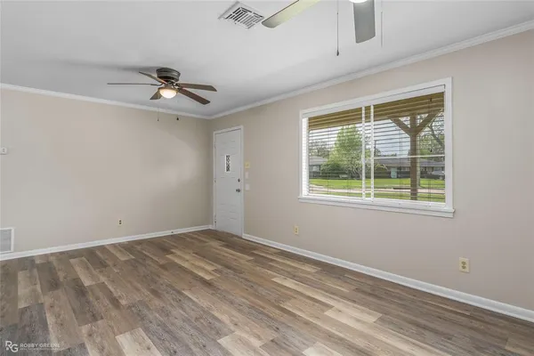 a view of a backyard with a garden and trees